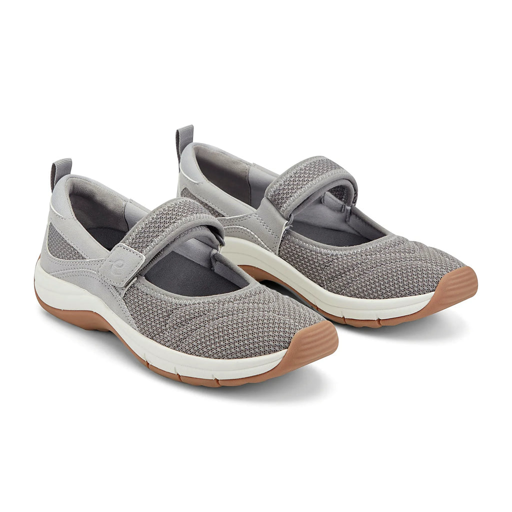 Hook-and-loop strap across the instep of a knit shoe