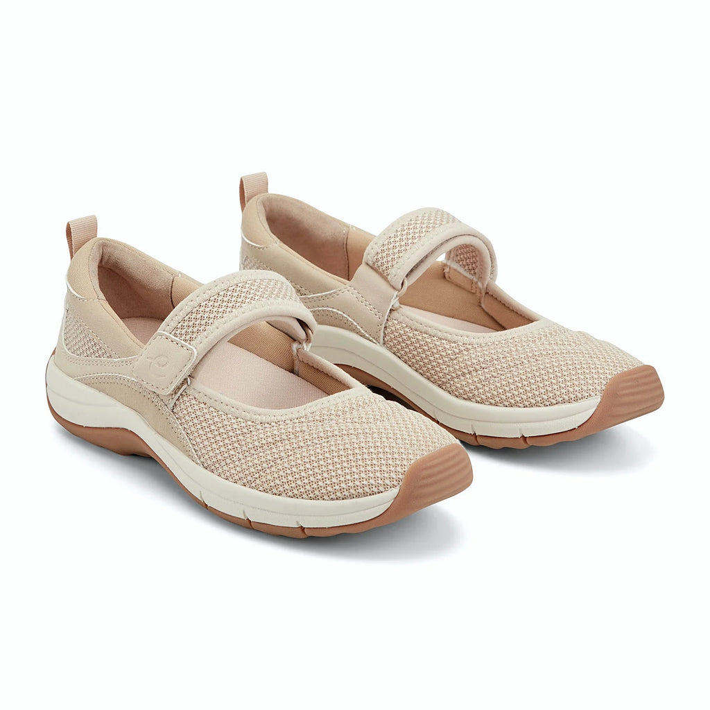 Hook-and-loop strap across the instep of a knit shoe