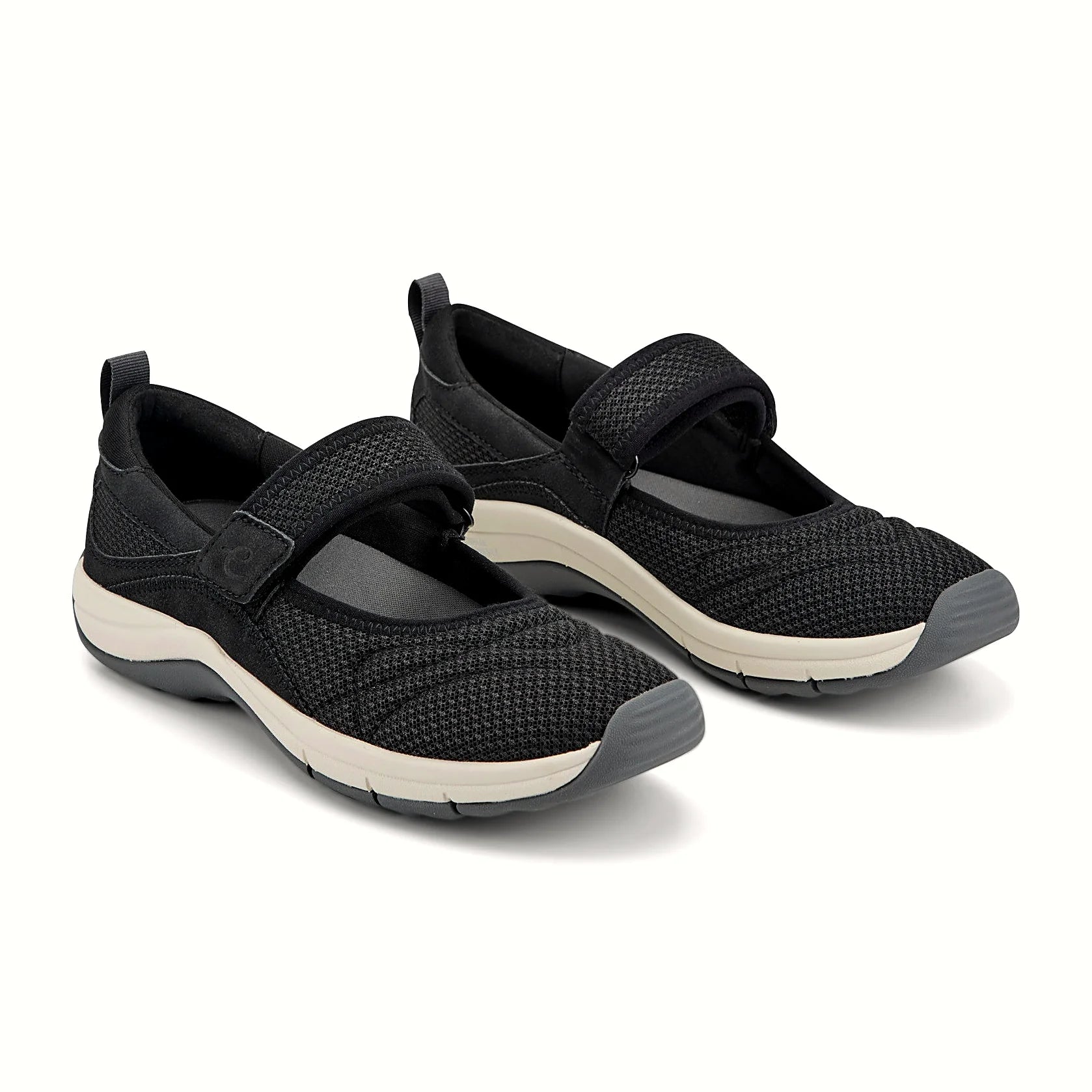 Hook-and-loop strap across the instep of a knit shoe
