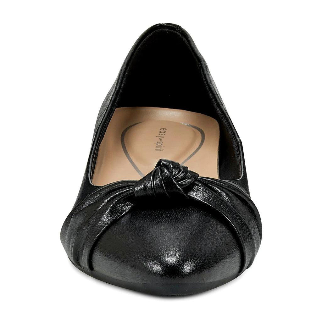 Low block heel under a pointy-toe pump