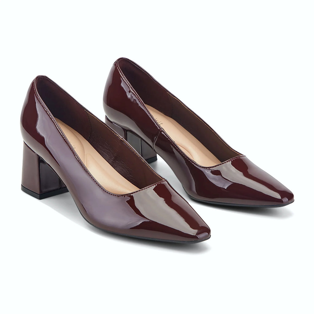Sleek block heel under a leather dress pump