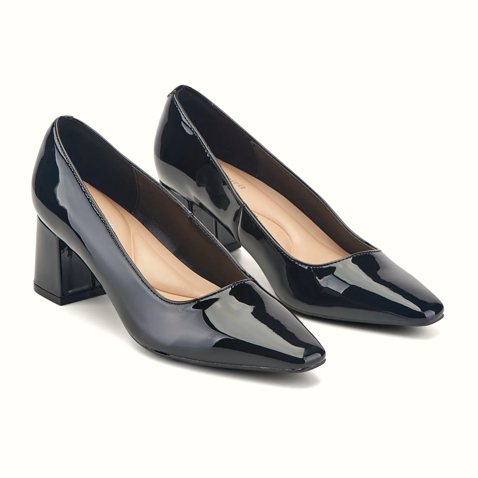 Sleek block heel under a leather dress pump