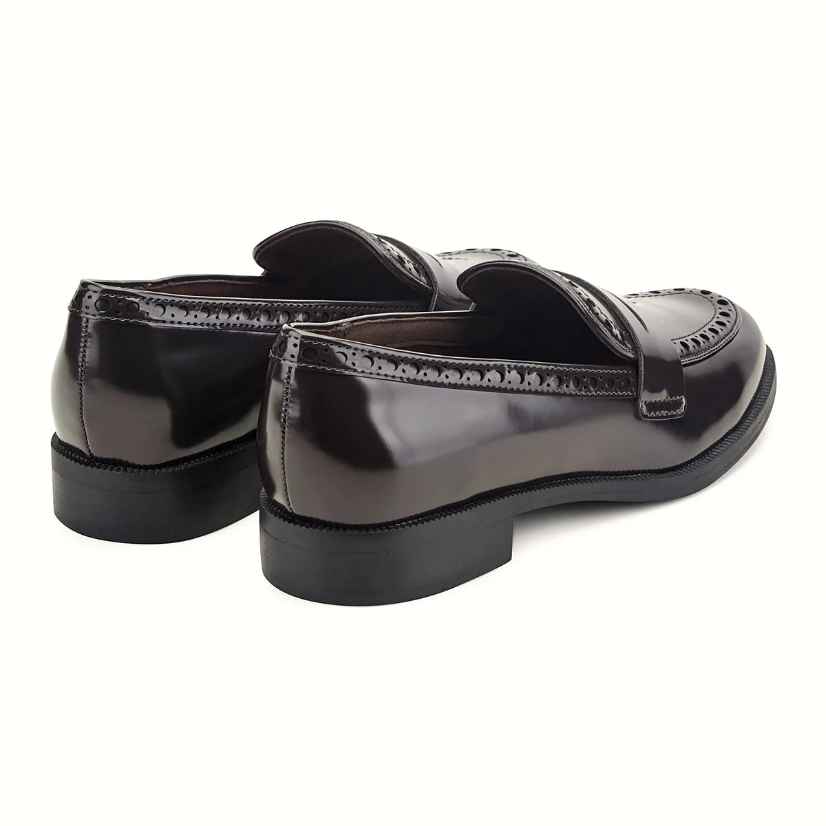 Low stacked heel under a high-shine loafer