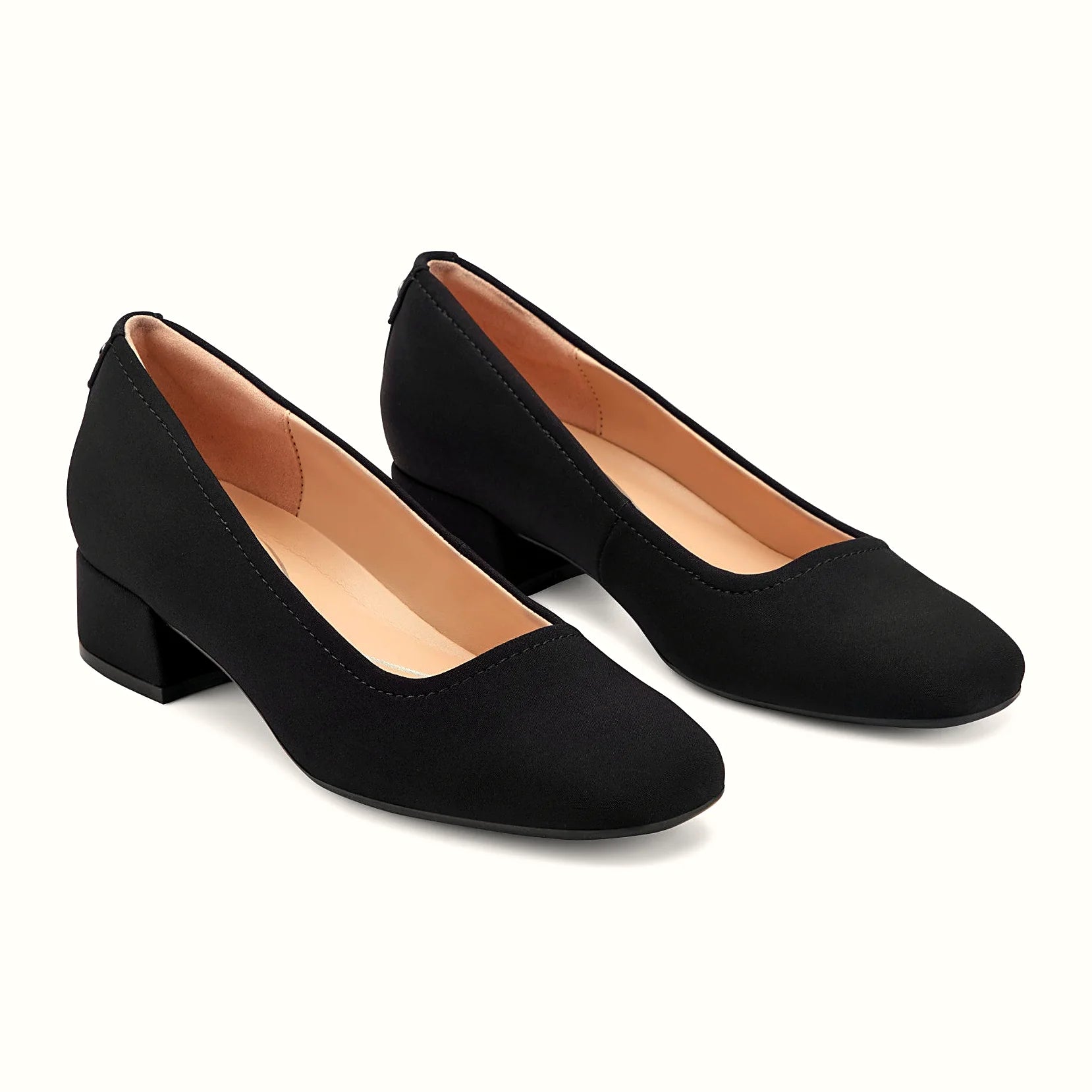 Low block heel under a leather dress pump