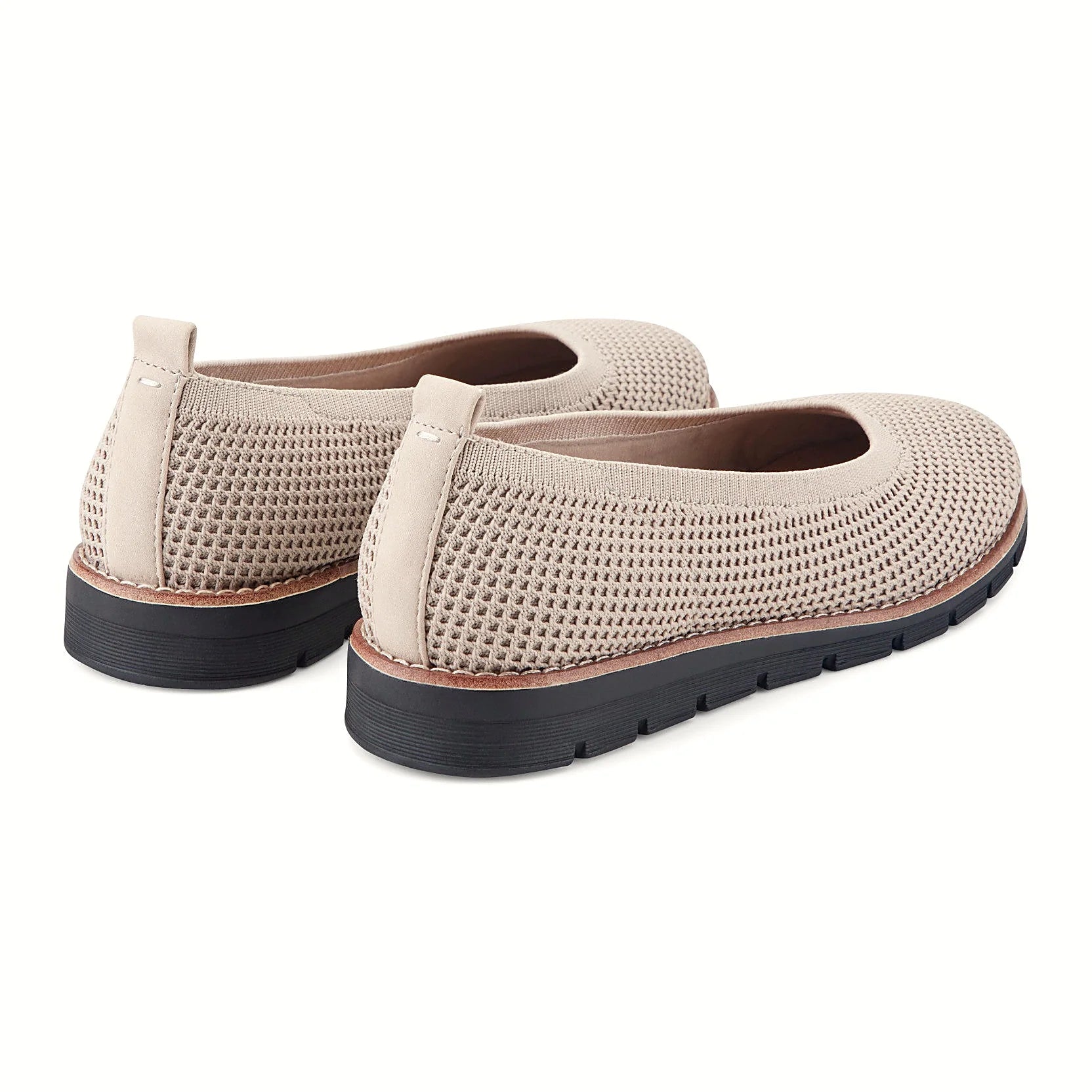Contrast-stitched trim along the sole of a knit slip-on