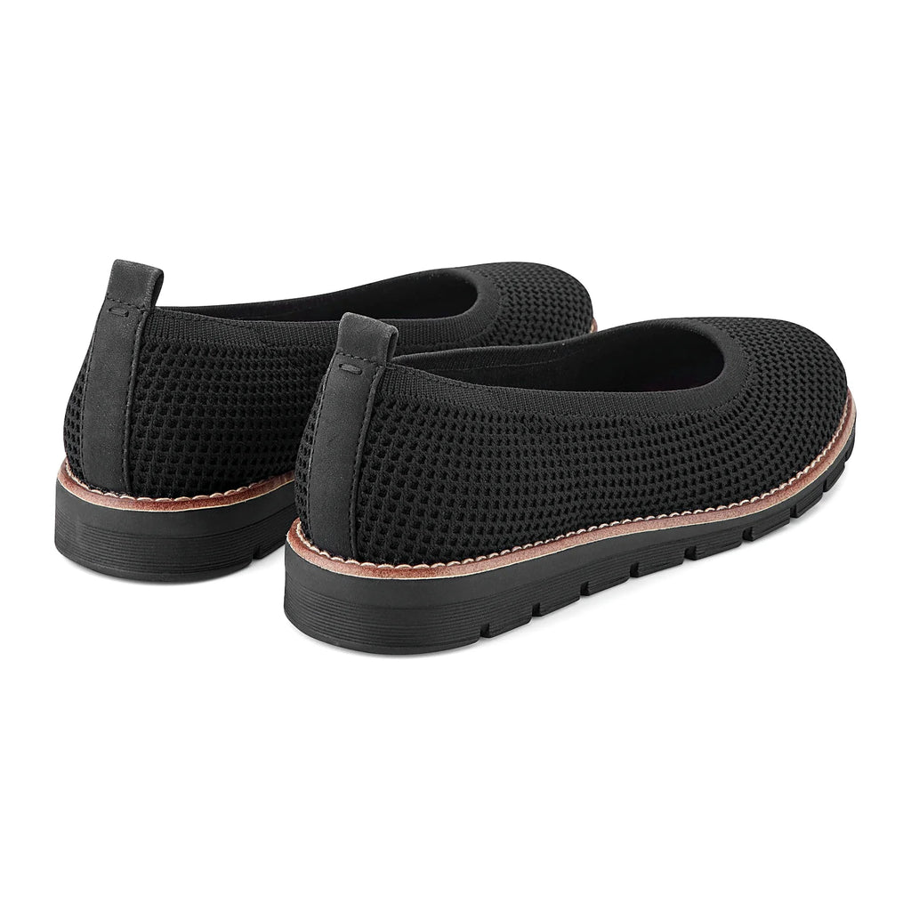 Contrast-stitched trim along the sole of a knit slip-on