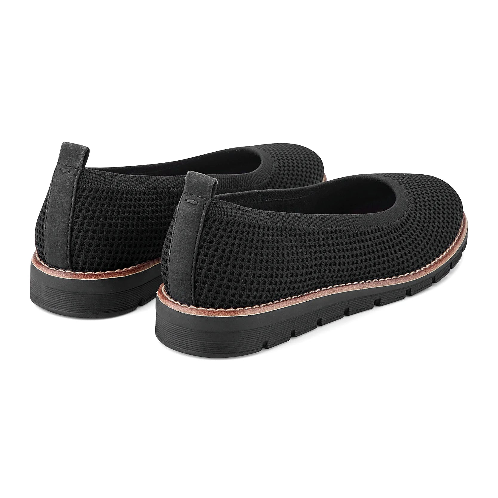 Contrast-stitched trim along the sole of a knit slip-on