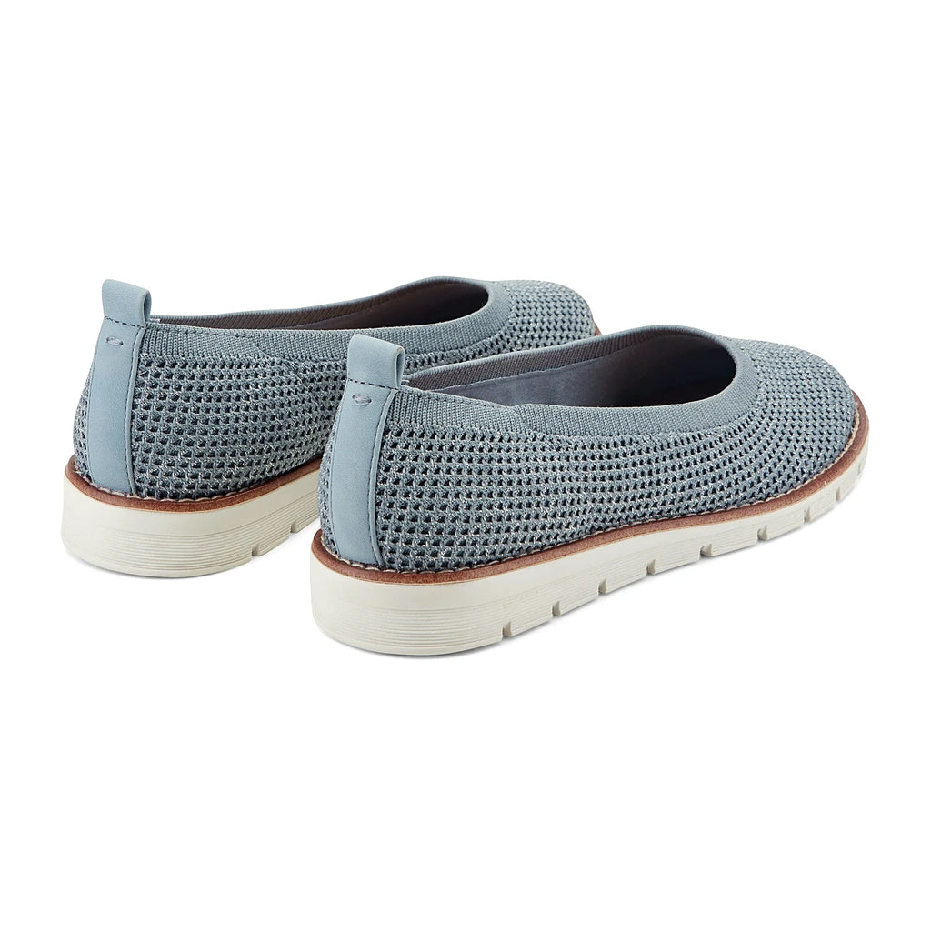 Contrast-stitched trim along the sole of a knit slip-on