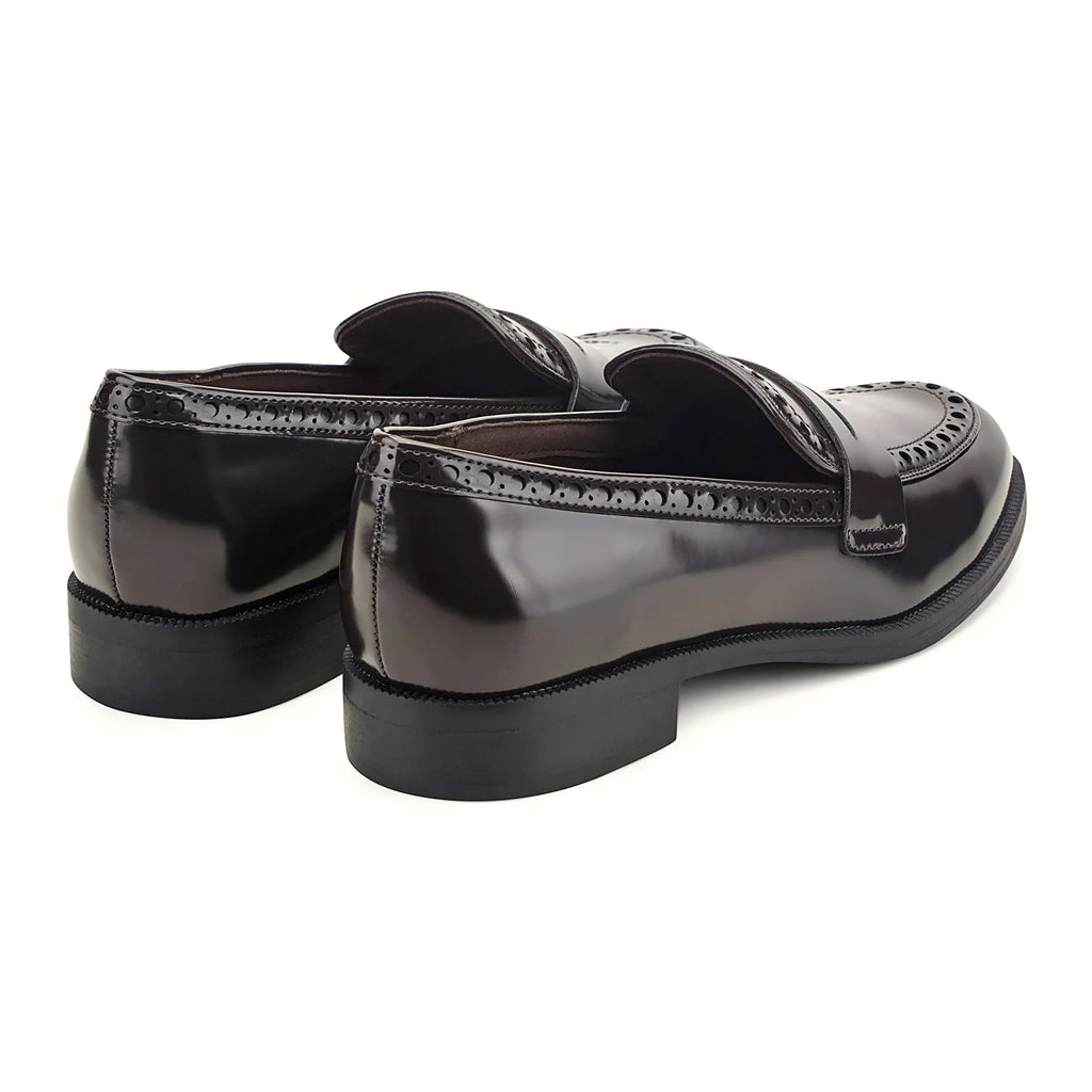 Low stacked heel under a high-shine loafer