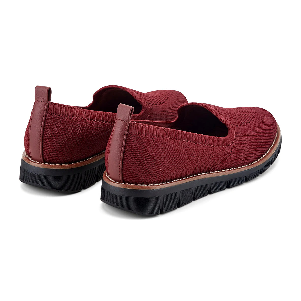Removable insole lifted out of a knit slip-on flat