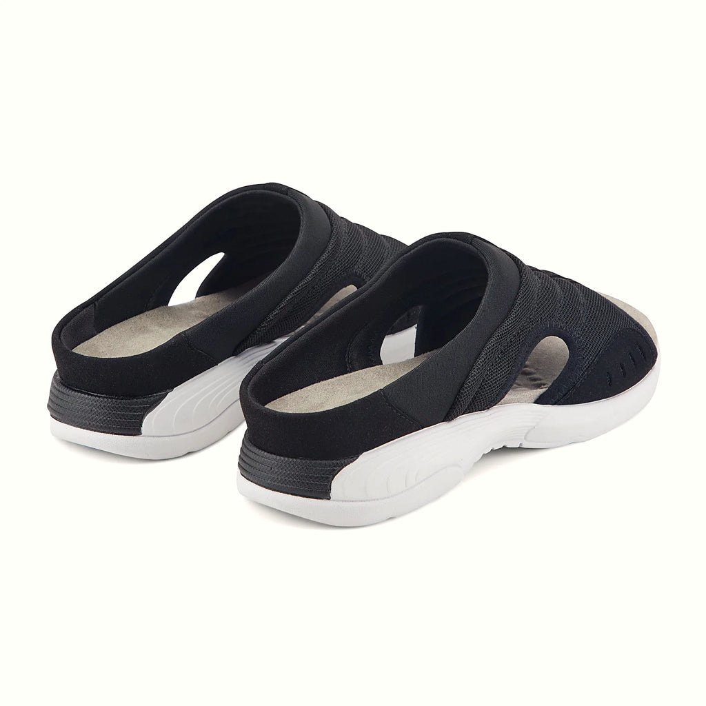 Textured massage pods on the footbed of a sandal