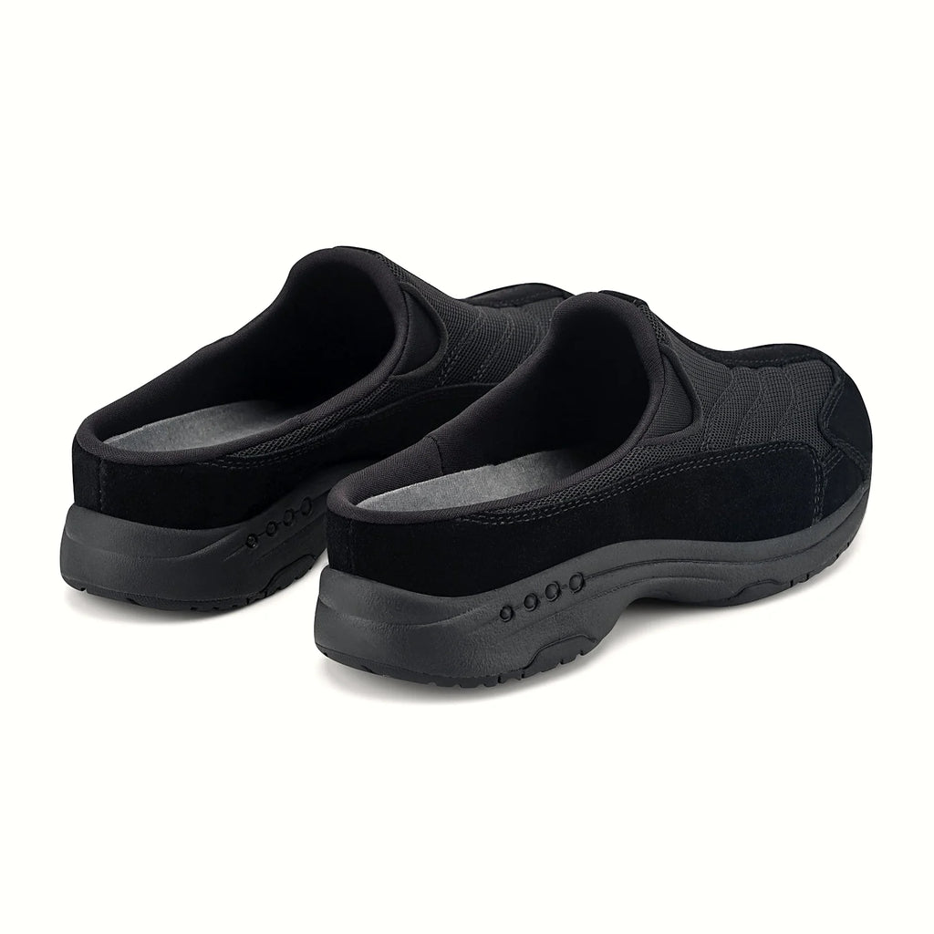 Molded footbed inside a suede-overlay clog