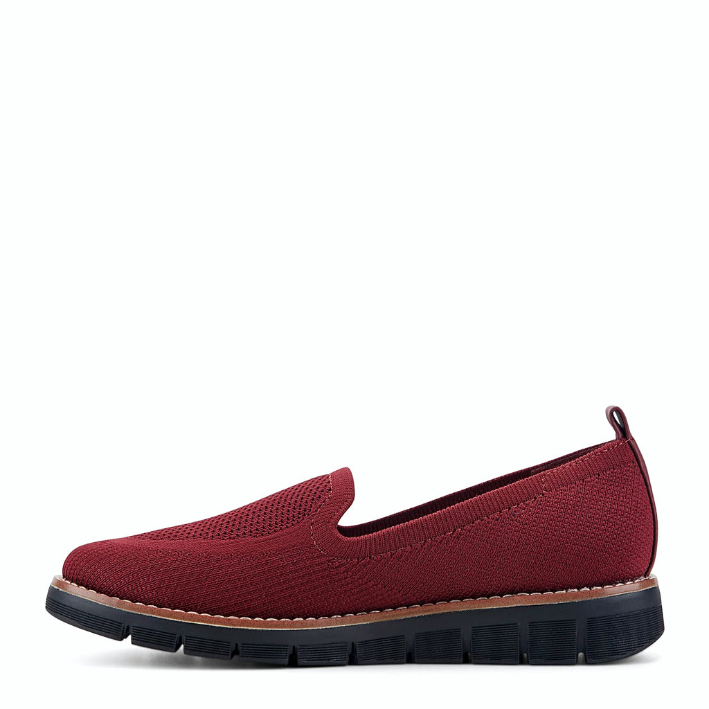 Knit slip-on flat with a stretch knit topline