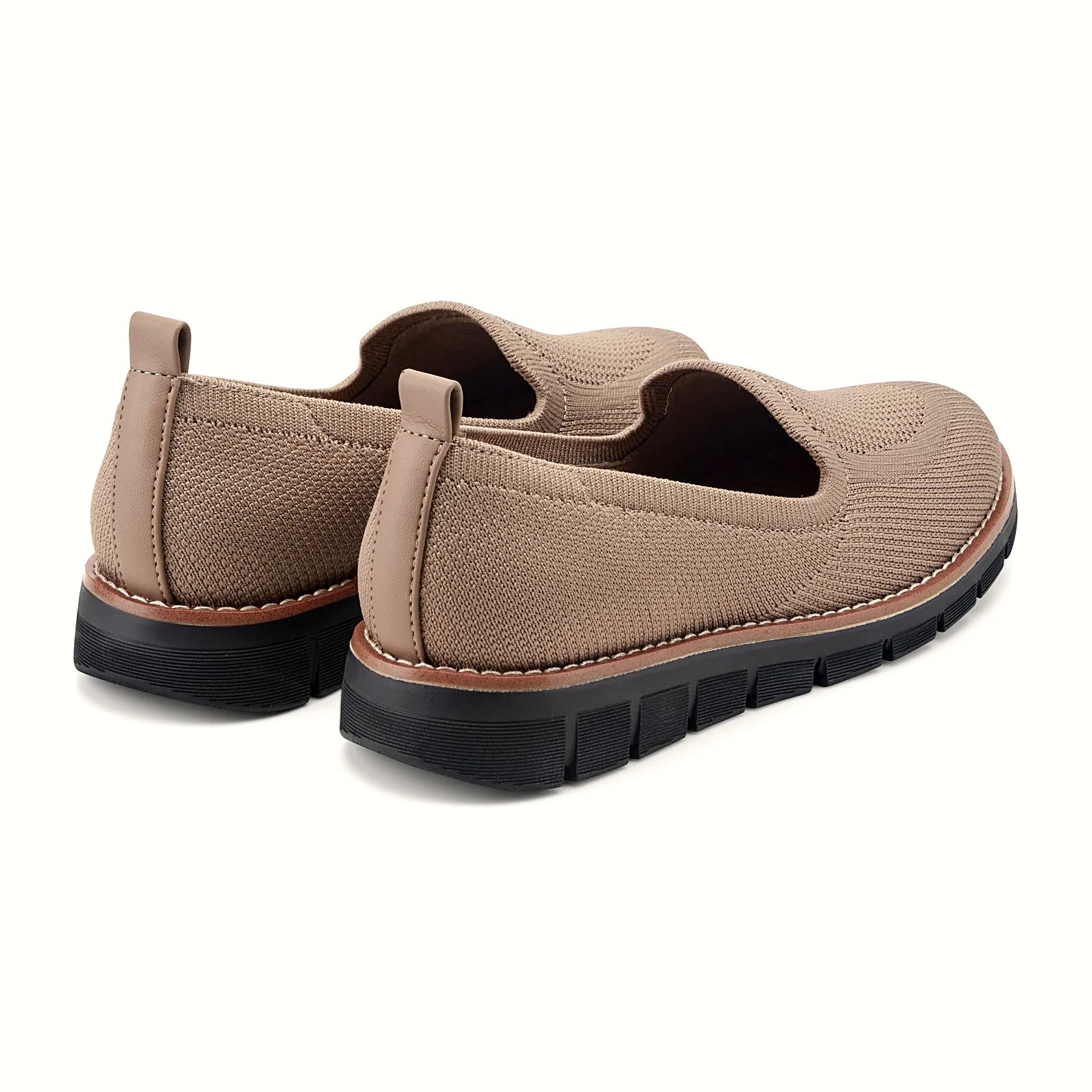 Contrast-stitched trim along the sole of a knit flat