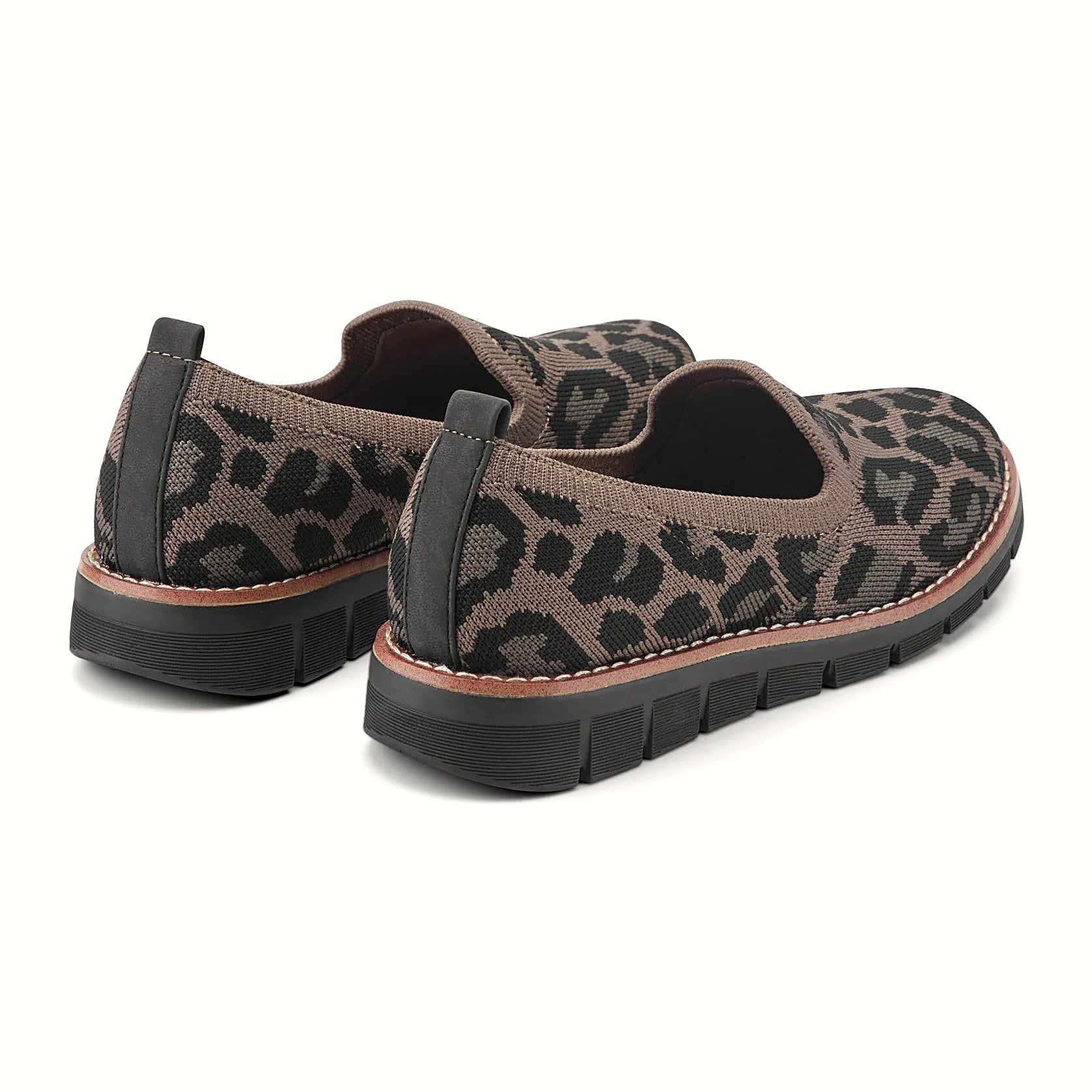 Contrast-stitched trim along the sole of a knit flat