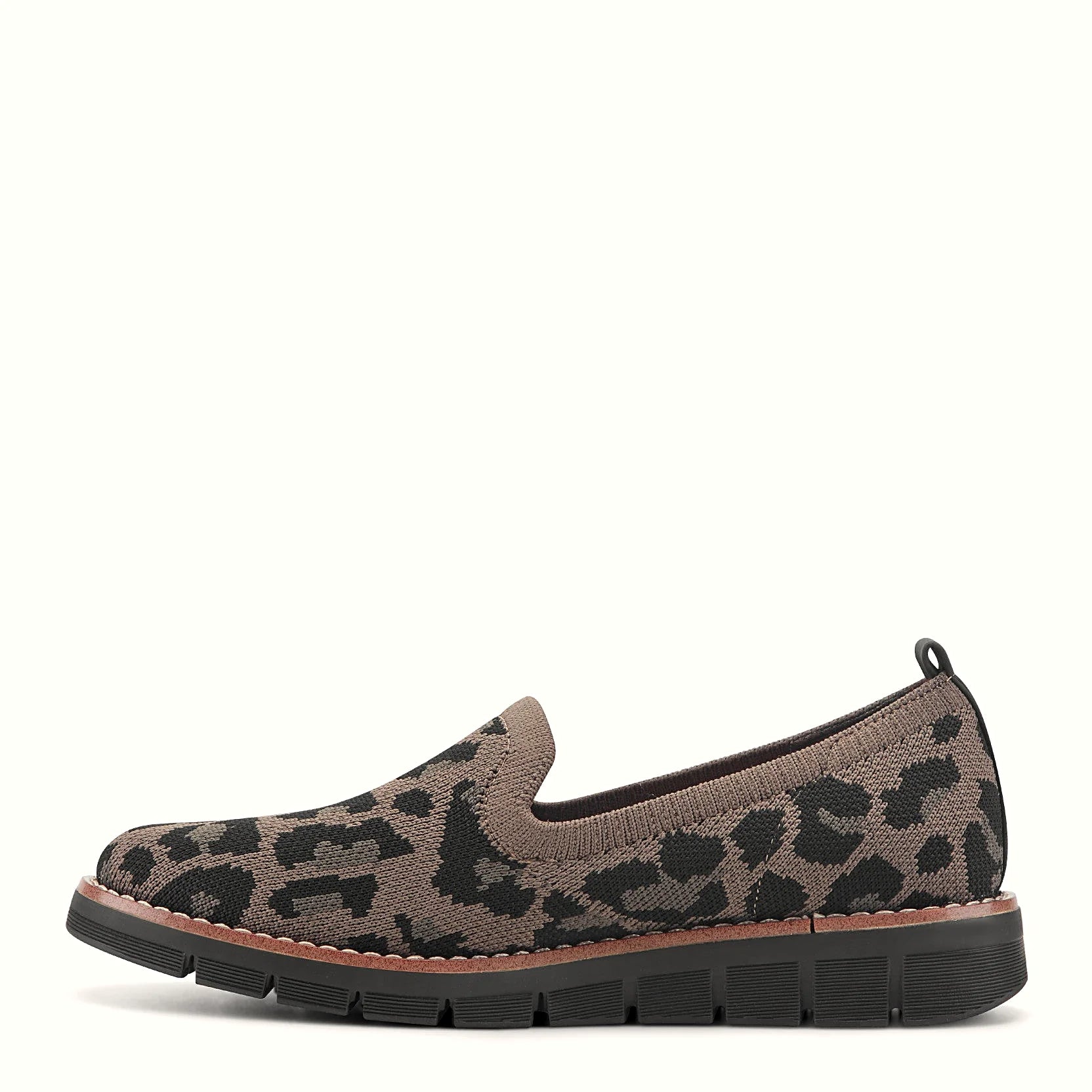 Removable insole lifted out of a knit slip-on flat