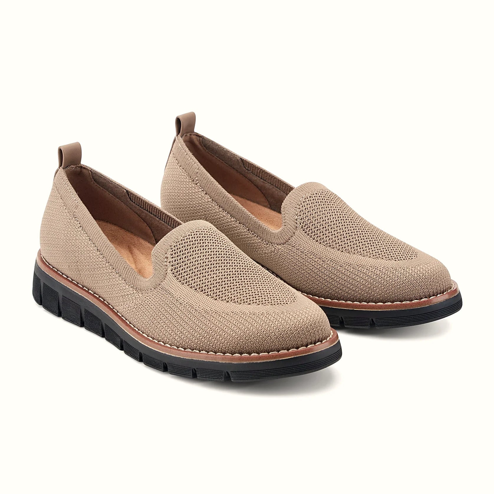 Pull tab at the heel of a knit slip-on flat