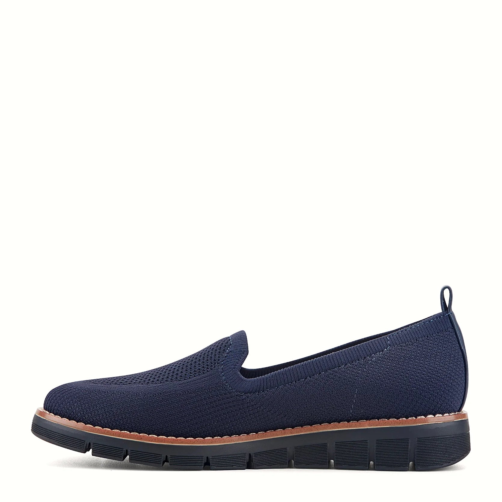 Pull tab at the heel of a knit slip-on flat