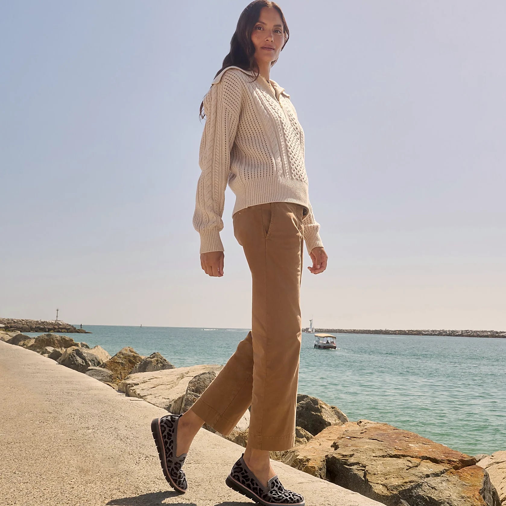 Pull tab at the heel of a knit slip-on flat
