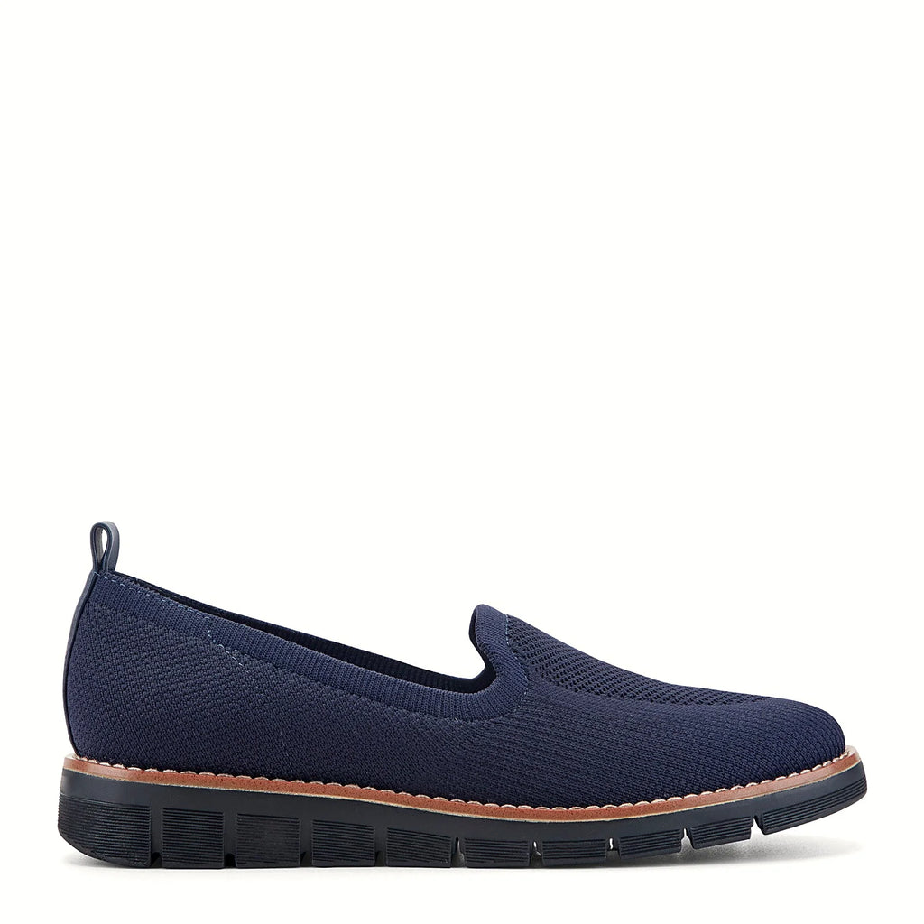 Contrast-stitched trim along the sole of a knit flat