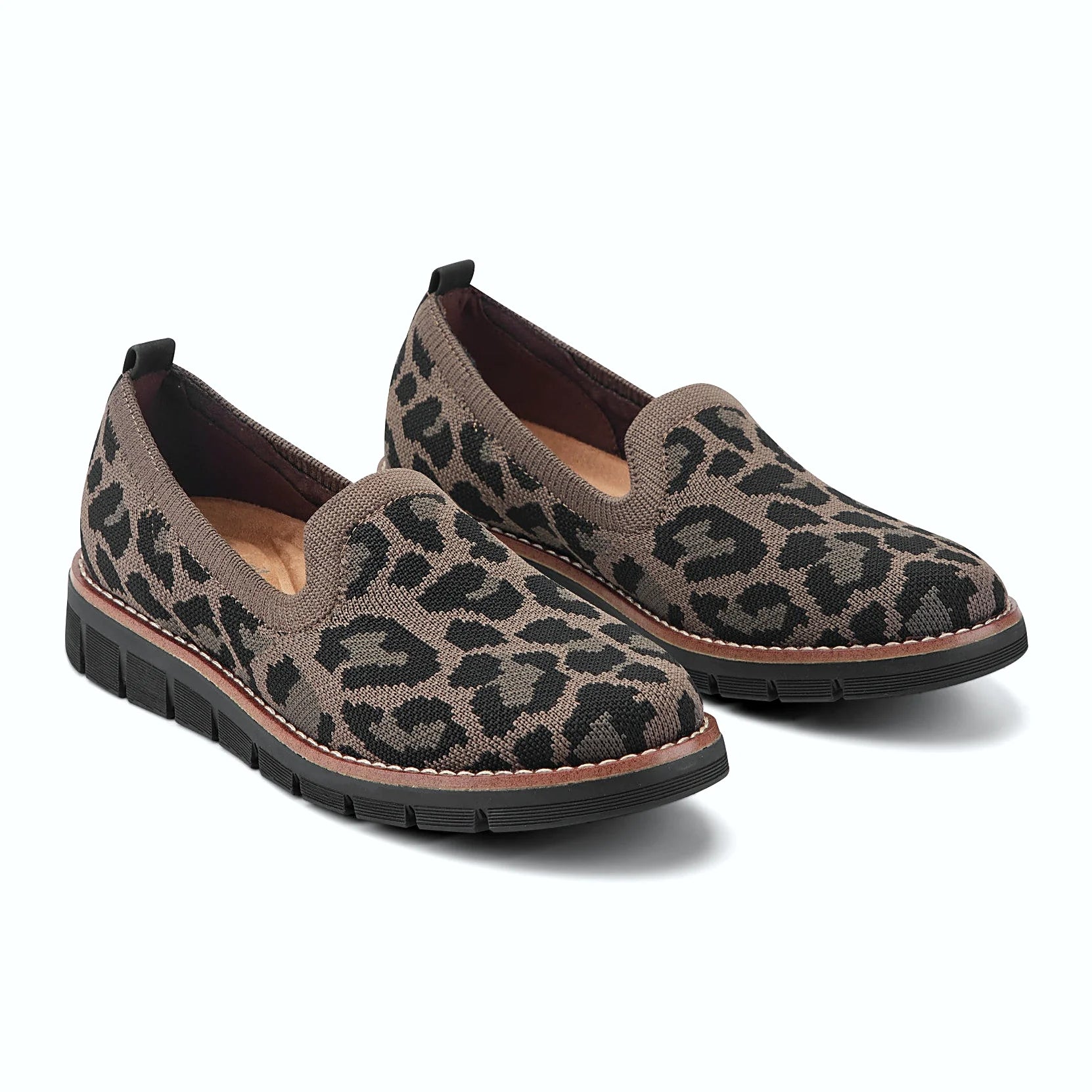 Pull tab at the heel of a knit slip-on flat