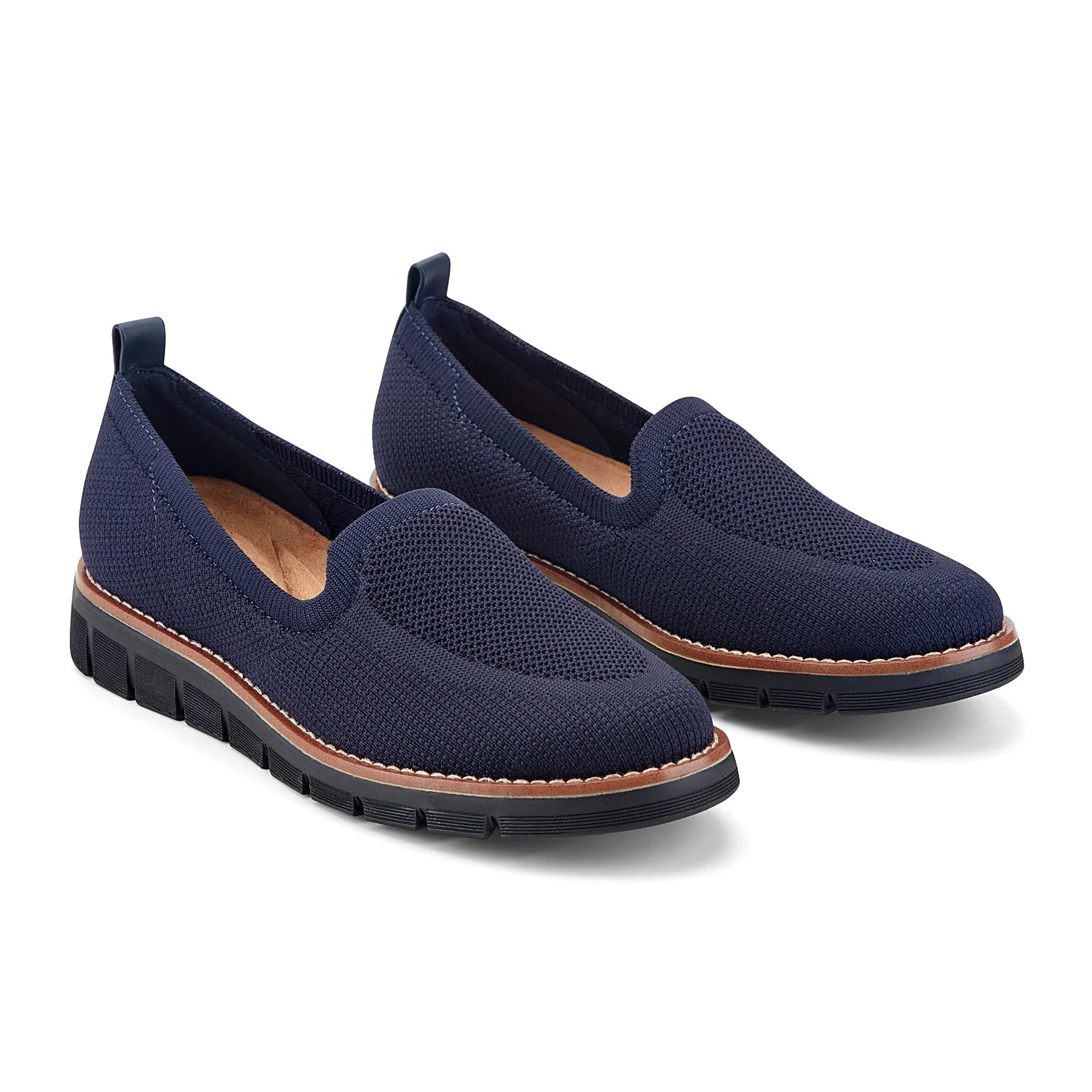 Removable insole lifted out of a knit slip-on flat