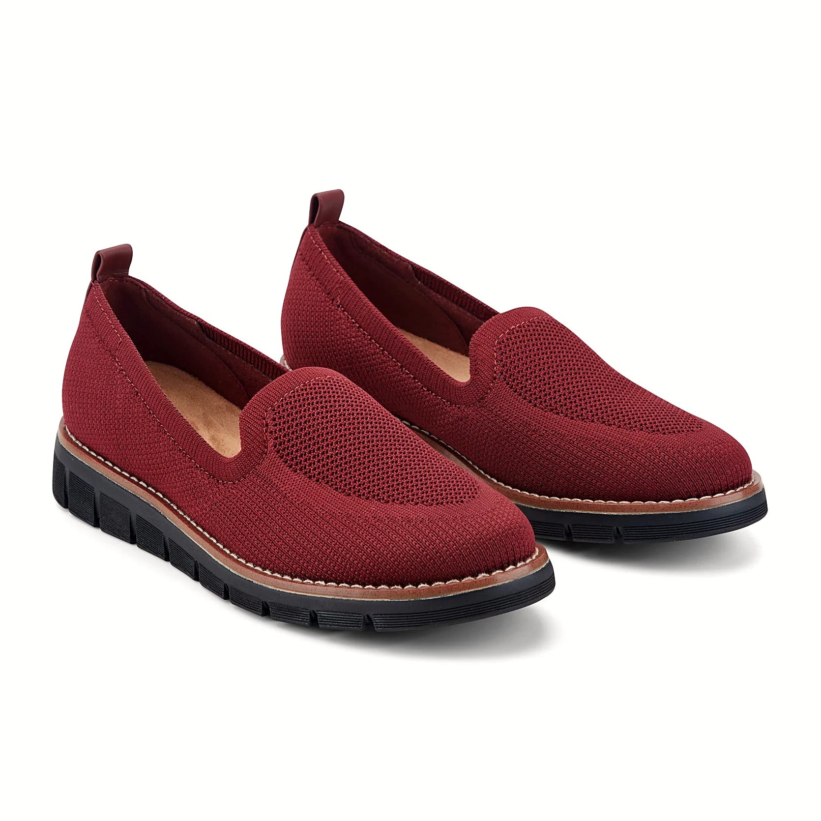 Contrast-stitched trim along the sole of a knit flat