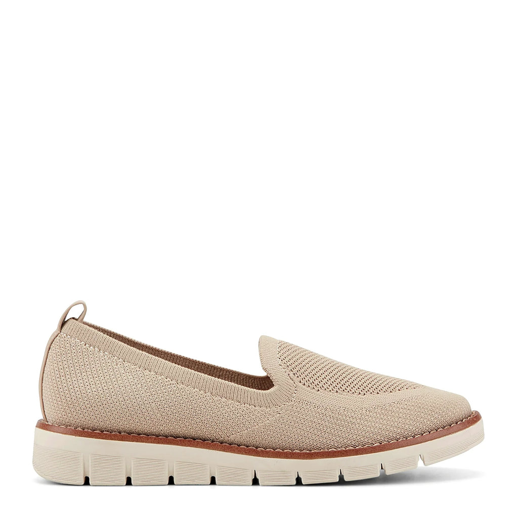 Removable insole lifted out of a knit slip-on flat