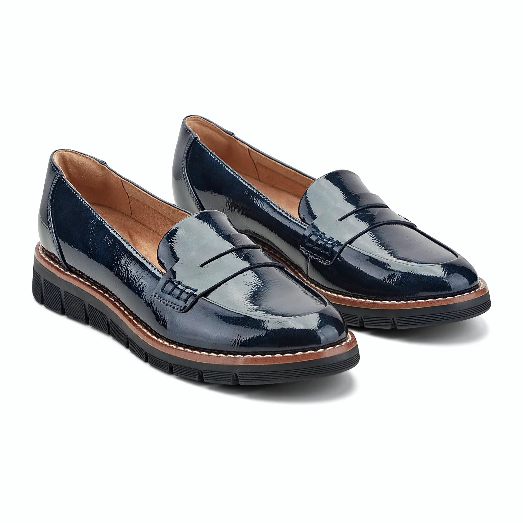 Decorative topstitching tracing the penny slot on a loafer