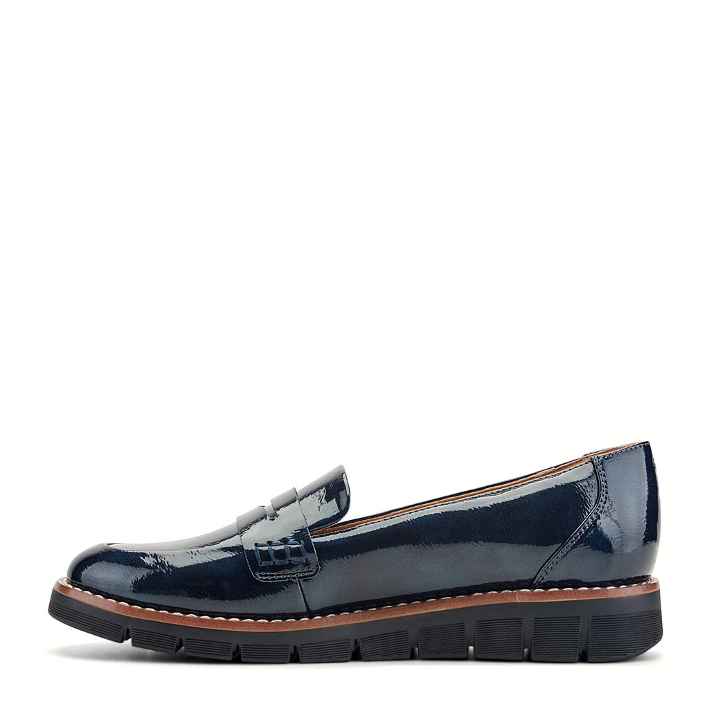 Molded footbed inside a slip-on penny loafer