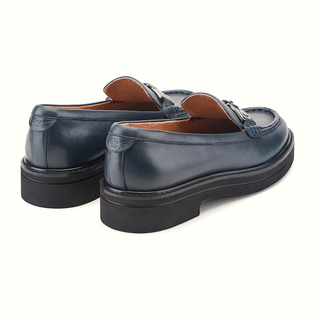 Round toe shape on a suede horsebit loafer