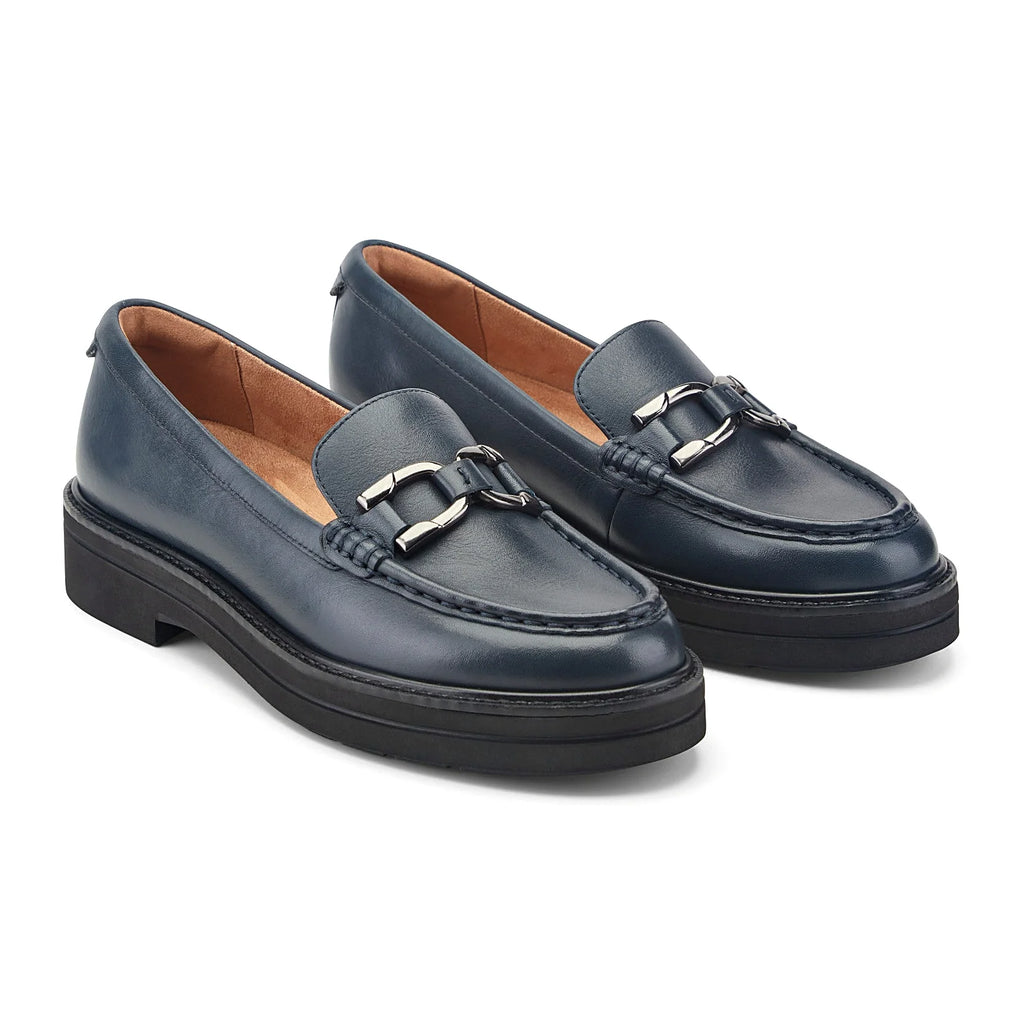 Textured welt border around the layered sole of a loafer