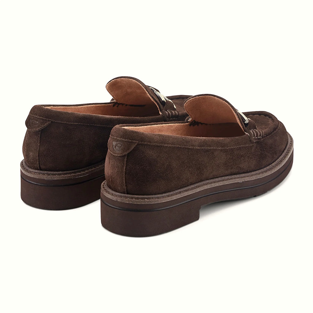 Textured welt border around the layered sole of a loafer