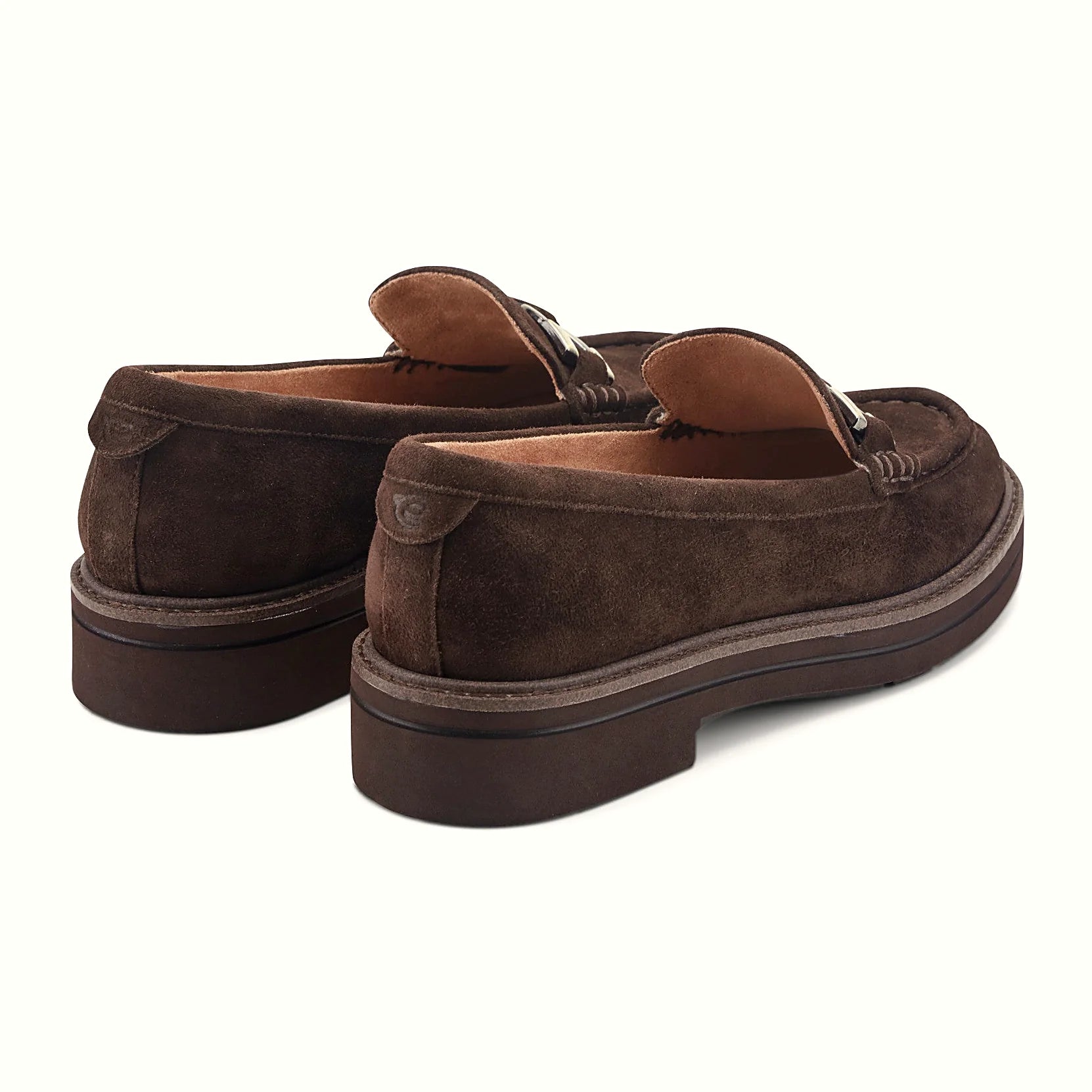 Textured welt border around the layered sole of a loafer